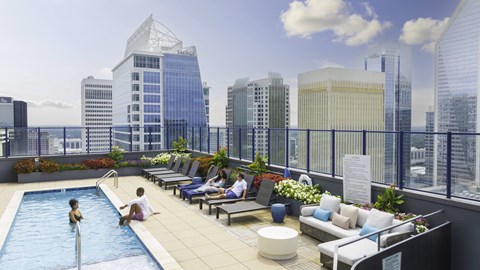 a rendering of a rooftop pool with a city skyline in the background