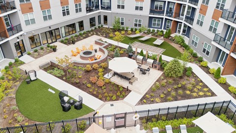 an aerial view of the courtyard of an apartment building