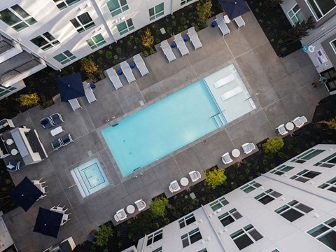 a swimming pool in the middle of an apartment building