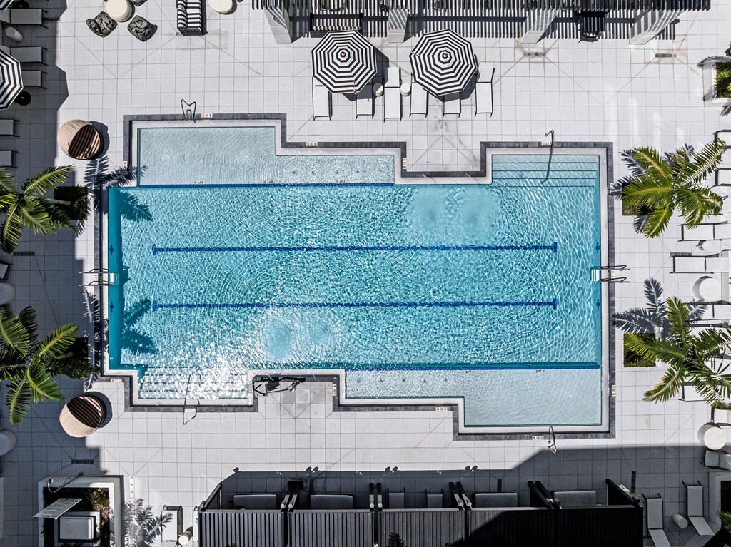 A large rectangular pool with a blue tiled edge.