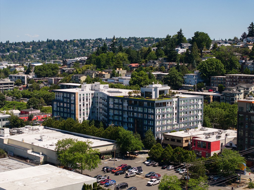 A cityscape with buildings and cars.
