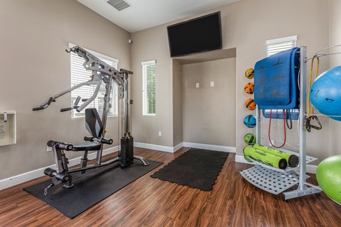 the preserve at ballantyne commons fitness room with exercise equipment and a tv