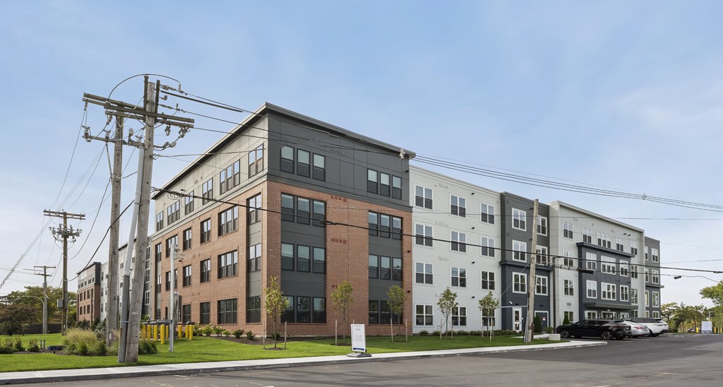 A large multi-story building with a mix of brick and panel construction.