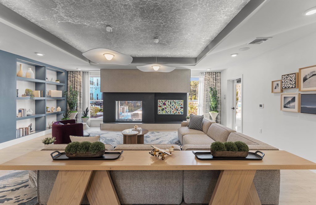 A modern living room with a large couch and a coffee table.