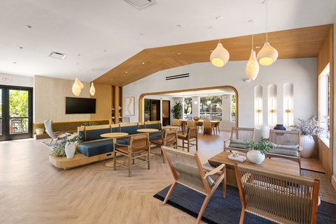 A modern living room with wooden furniture and a flat screen TV.