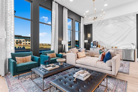 A modern living room with a large window and a view of the outside.