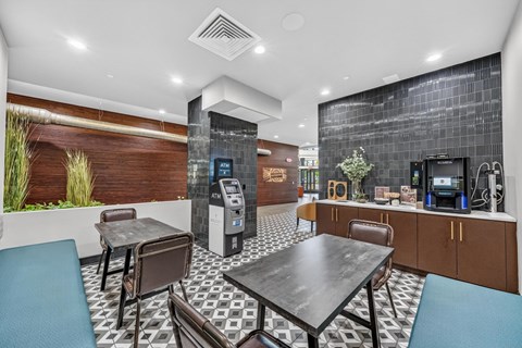A modern dining area with a black table and chairs.