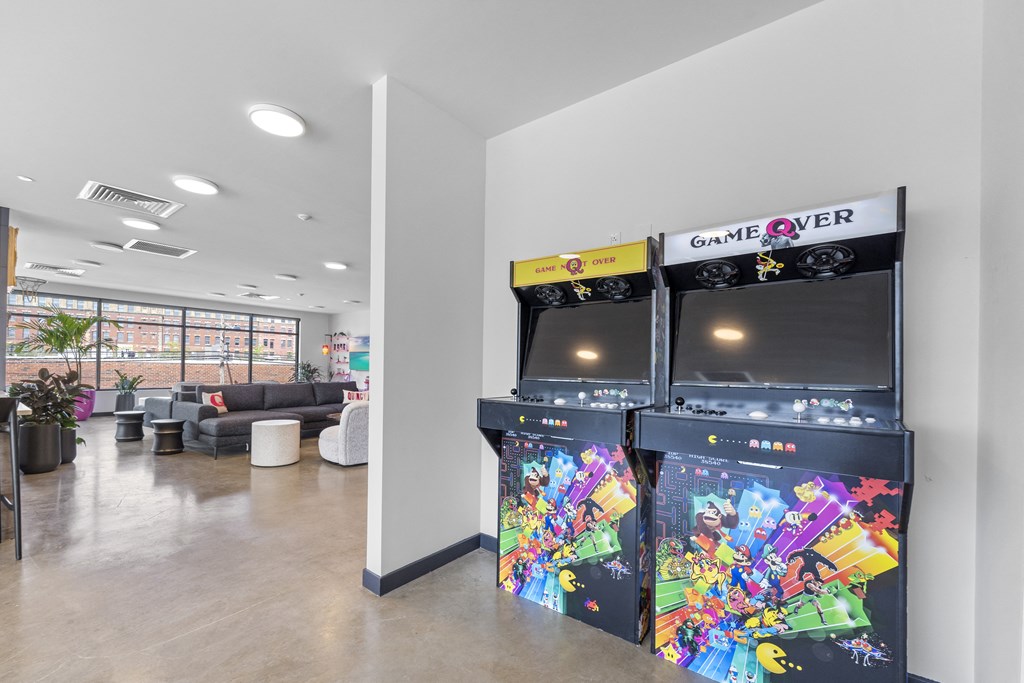 a room with two video games and two televisions