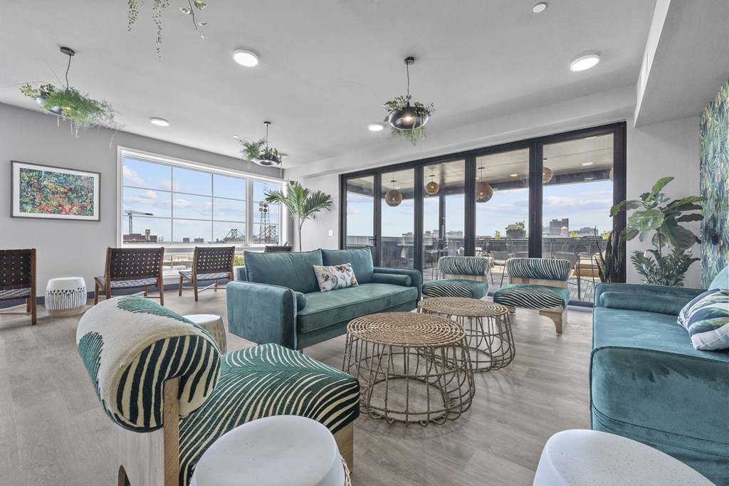 a living room filled with furniture and a large window