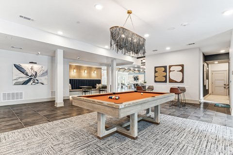 Resident clubhouse with pool table at Alta Riverside Irving apartments in TX.