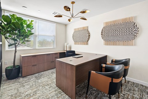 a conference room with a table and chairs and a window