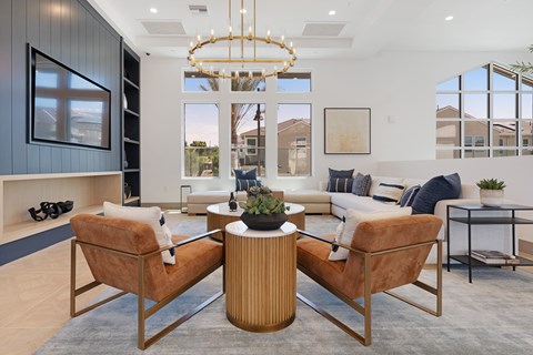 A modern living room with a large window, a sofa set, and a coffee table.