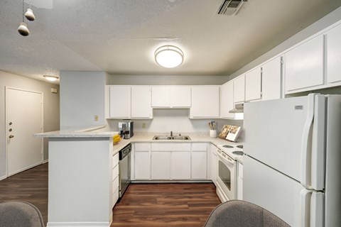 the preserve at ballantyne commons apartment kitchen with white cabinets and appliances