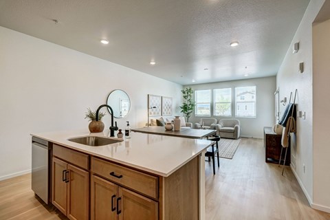 A kitchen with wooden cabinets and a white countertop.