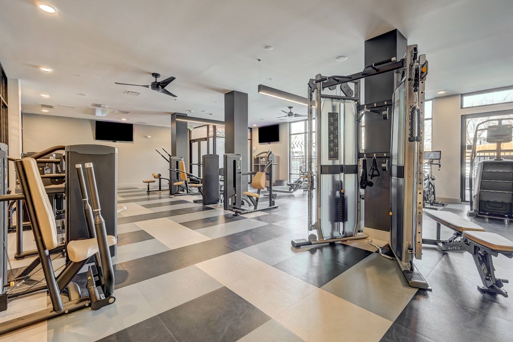 a gym with weights machines and other exercise equipment