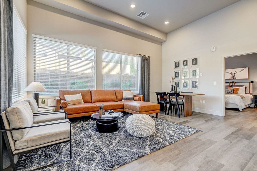 Living room with tall ceilings and large windows for natural light
