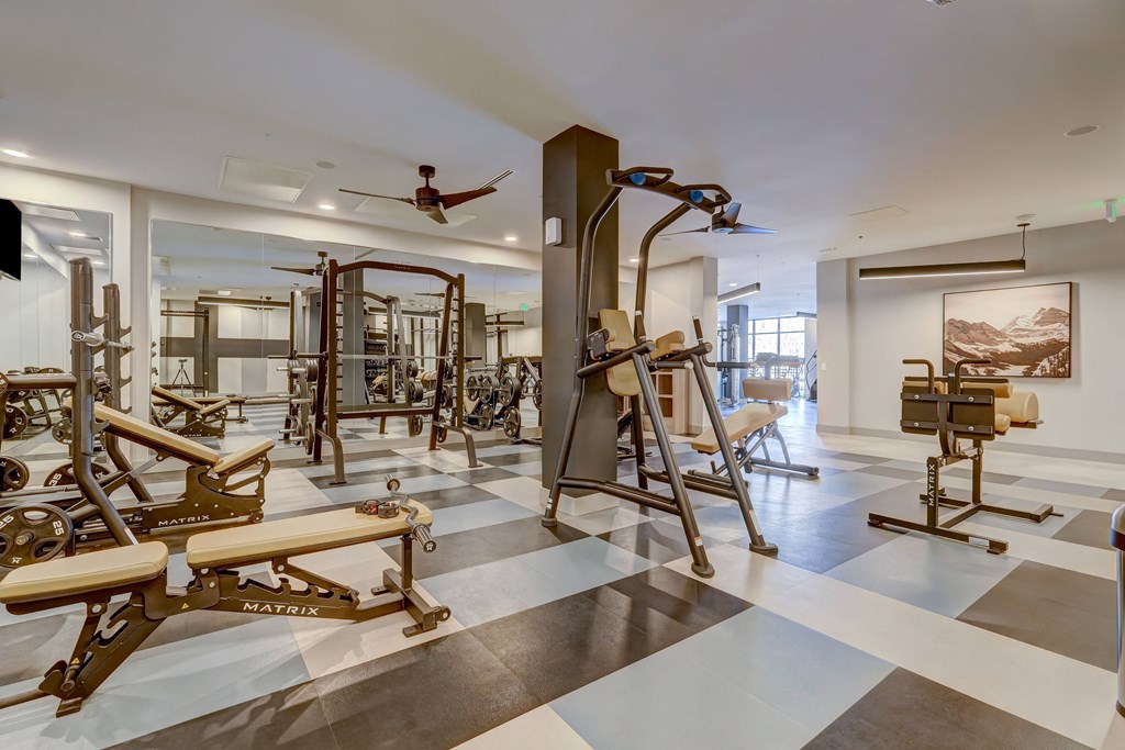 a room filled with lots of different types of exercise equipment