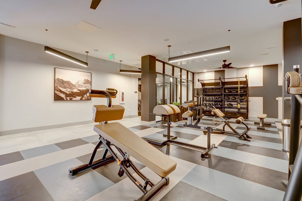 a room filled with lots of different types of exercise equipment