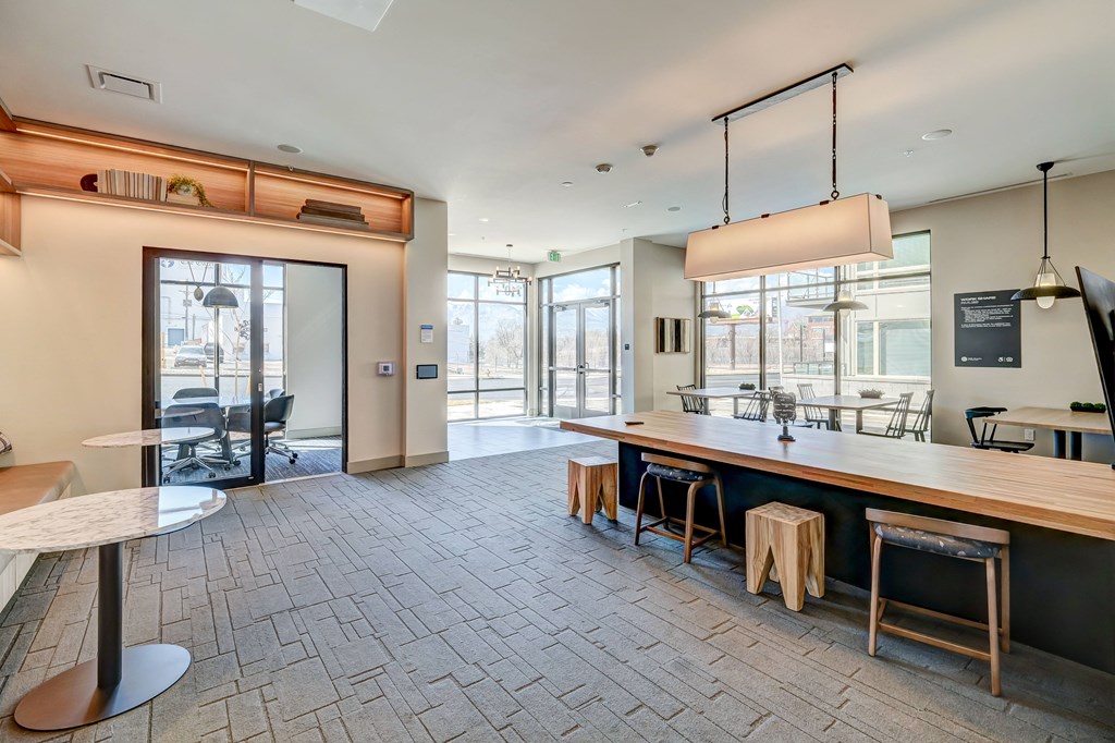 a large room with a long wooden table and chairs
