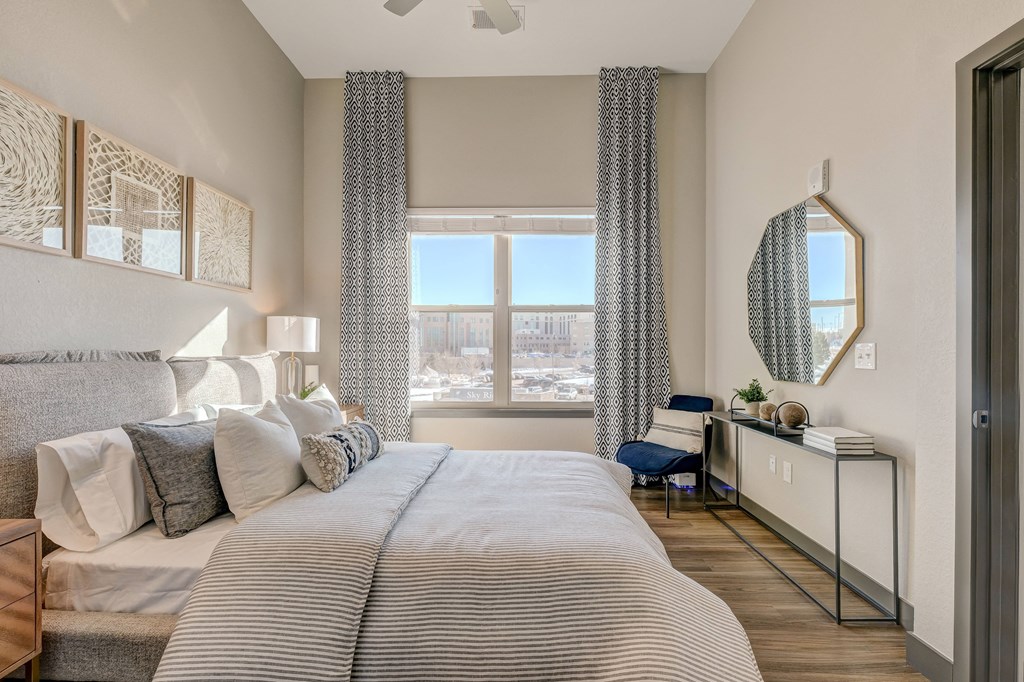 Model bedroom with view outside at Novus, Colorado