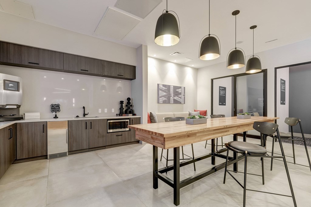 a kitchen and dining area in a 555 waverly unit