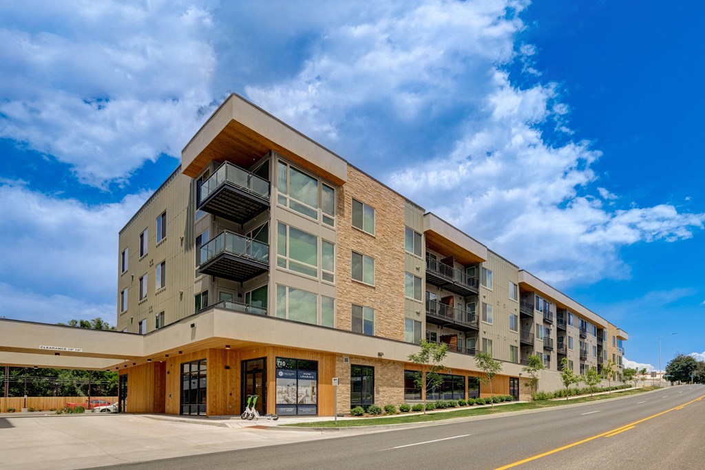 a photo of the front of the building with a blue sky in the background