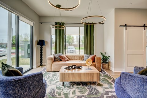 A living room with a sofa, chairs, and a coffee table.