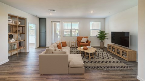 a living room with a couch and a tv