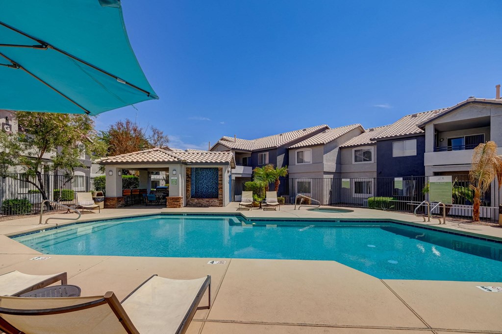 our apartments offer a swimming pool with chairs and umbrellas