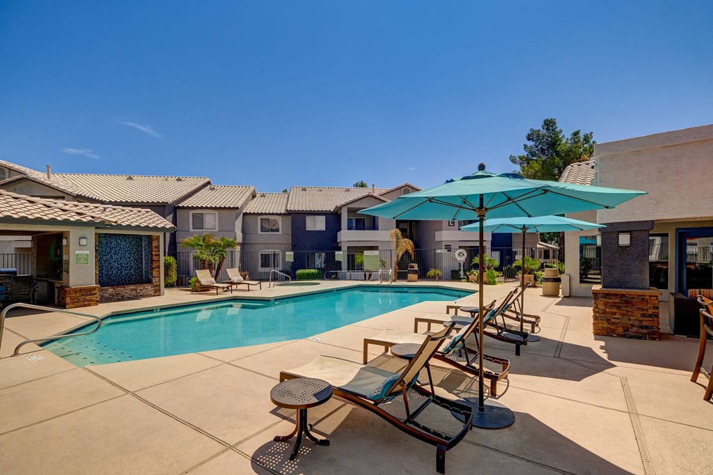 our apartments offer a swimming pool with chairs and umbrellas