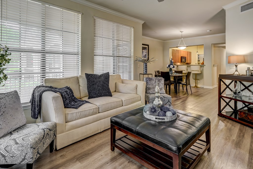 A living room with a couch, chair, and coffee table.