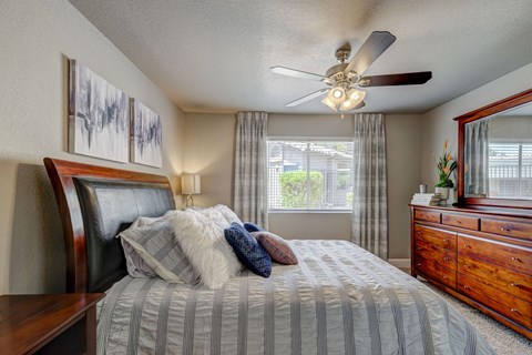 Bedroom with ceiling fan at Allure at Tempe Apartments, Tempe, AZ