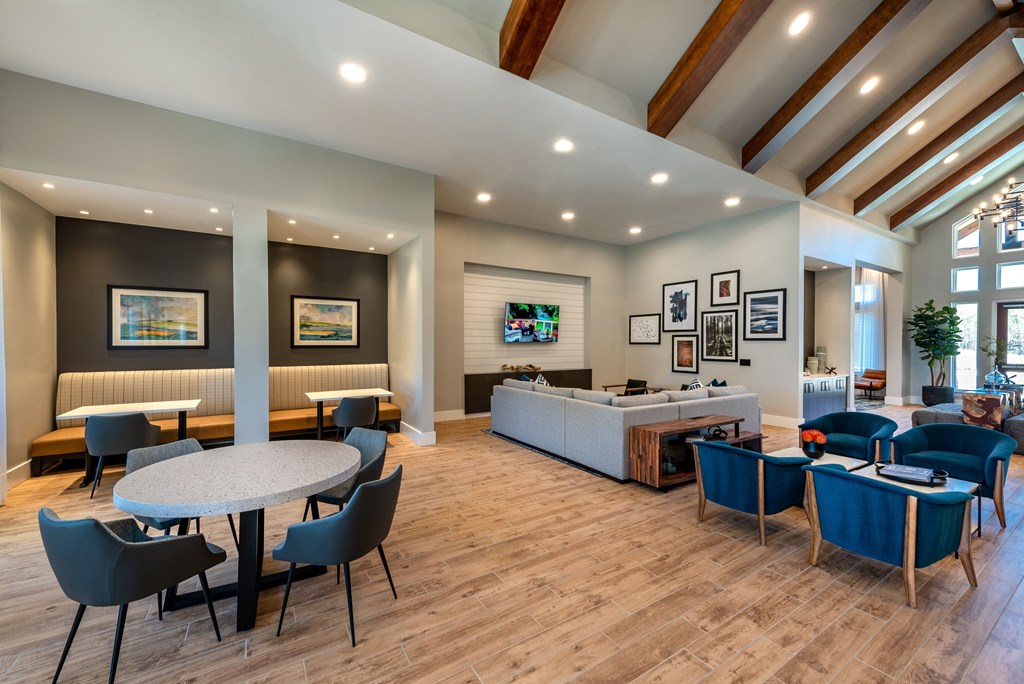 A spacious room with a white table surrounded by chairs. at Brandywine Green, Maryland, 20613