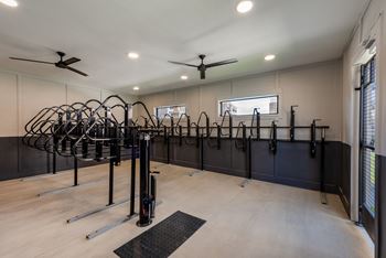 A gym with a variety of exercise equipment.