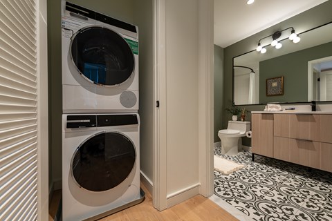 A modern laundry room with a washer and dryer.