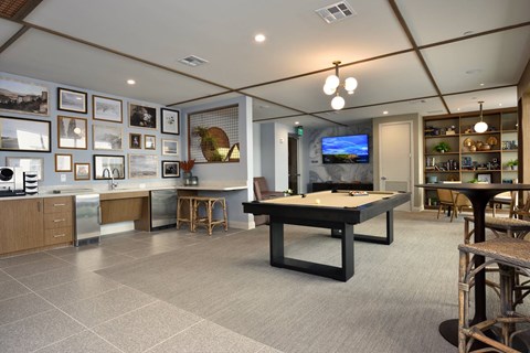 Game room with billiards table at The Flats at West Alabama Upper Kirby luxury apartments.