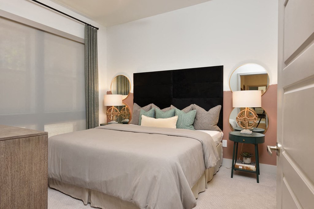 Bedroom with cozy bed at The Flats at West Alabama, Houston, TX