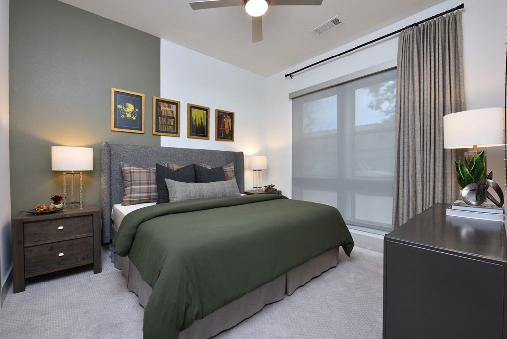 Bedroom with cozy bed and lights at The Flats at West Alabama, Houston, 77027