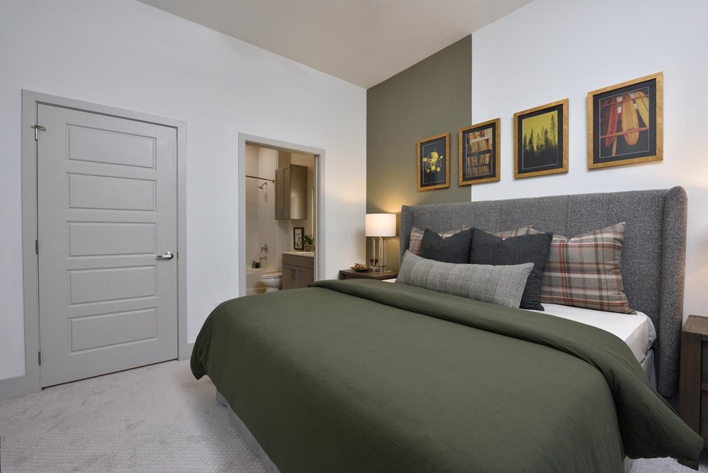 Bedroom with cozy bed and decor at The Flats at West Alabama, Houston, Texas