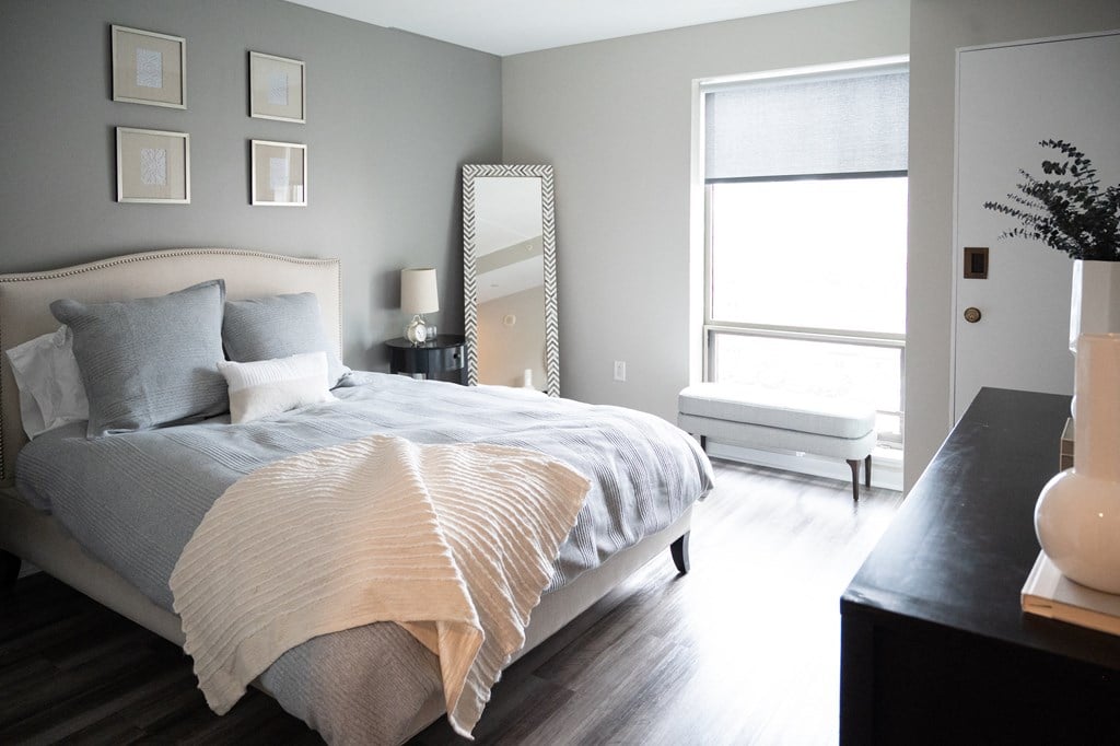 a bedroom with a bed and a dresser