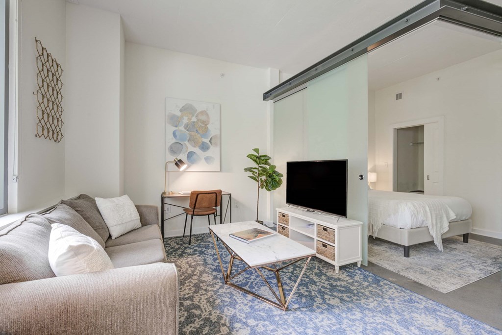 a living room with a couch and a tv