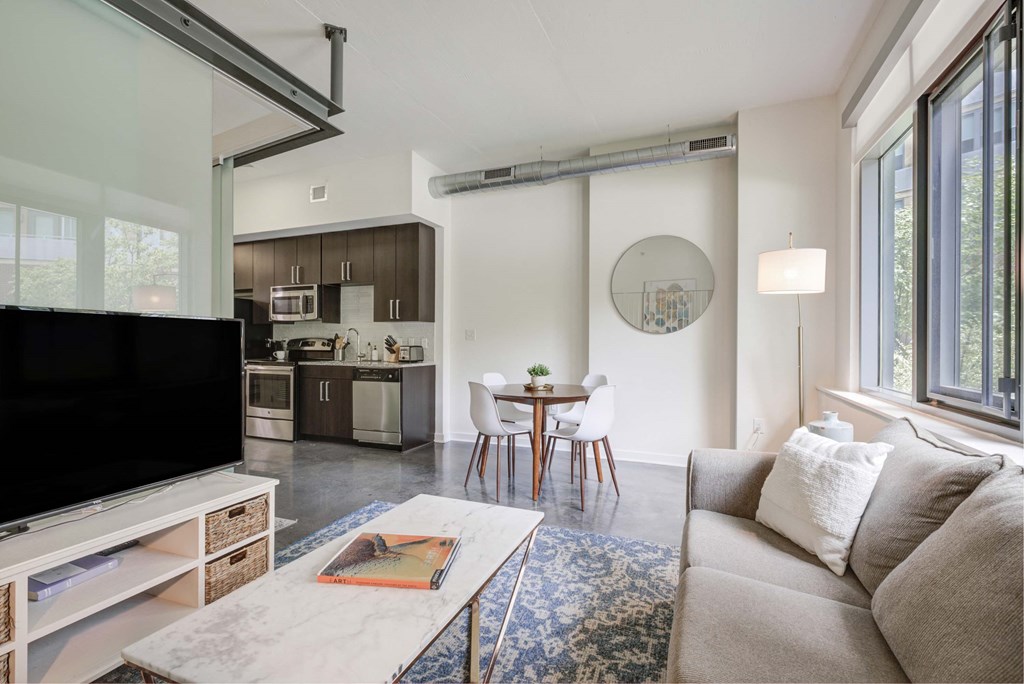 a living room with a couch and a table and a tv