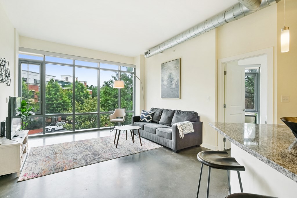 a living room with a couch and a large window
