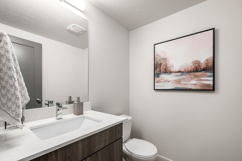 the preserve at ballantyne commons bathroom with sink toilet and mirror