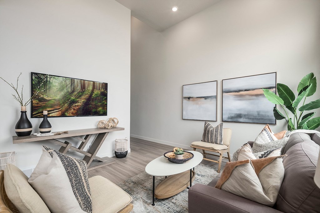 the living room of a home with a couch and a table
