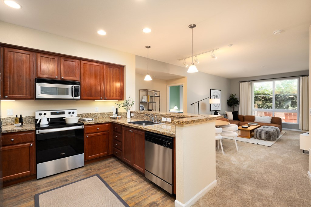 a kitchen and living room with a counter top
