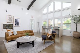 a living room with white walls and ceilings and a large window - Photo Gallery