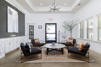 a living room filled with furniture and a large window - Photo Gallery
