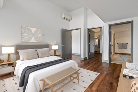 Bedroom with a large bed and a closet at Equinox, Seattle, WA, 98102