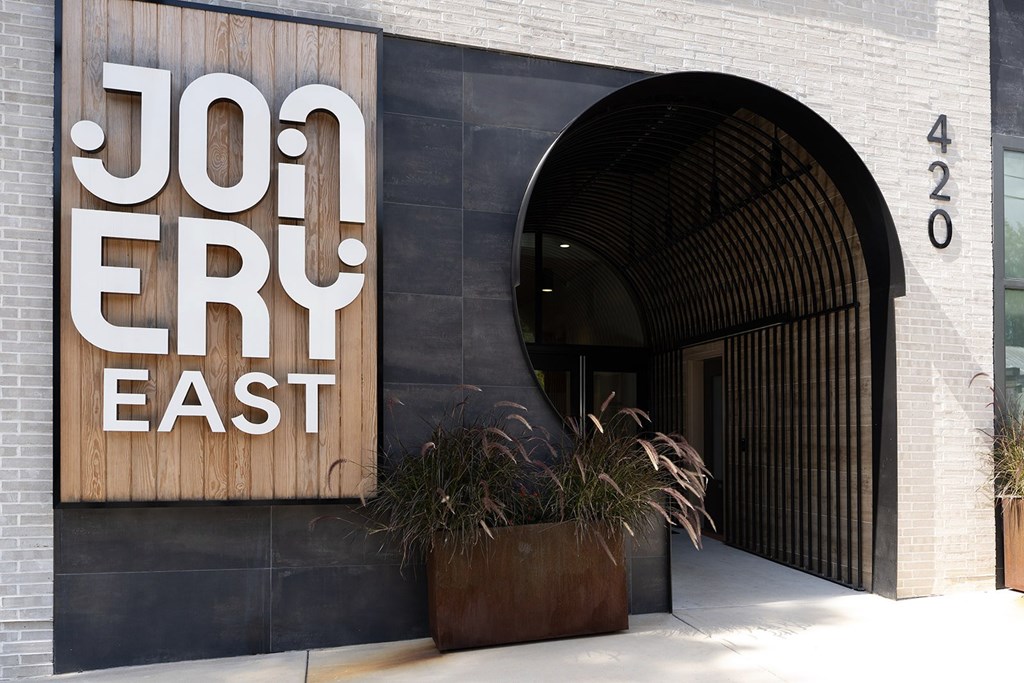 A building with a sign that says Jon Ery East.